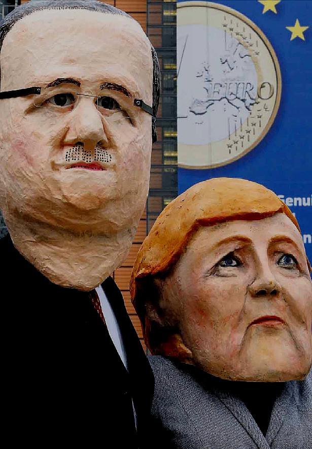 Maschere di Hollande e Merkel ai cortei di protesta per le politiche economiche in Europa; fonte Emmert